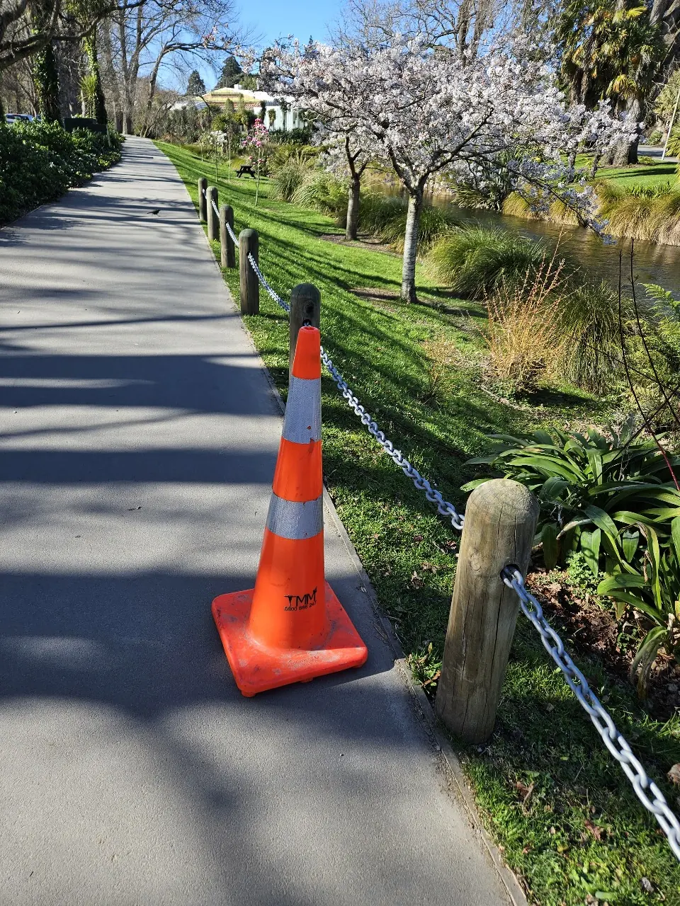 TM Matters cone protecting a pedestrian pathway beside a waterway